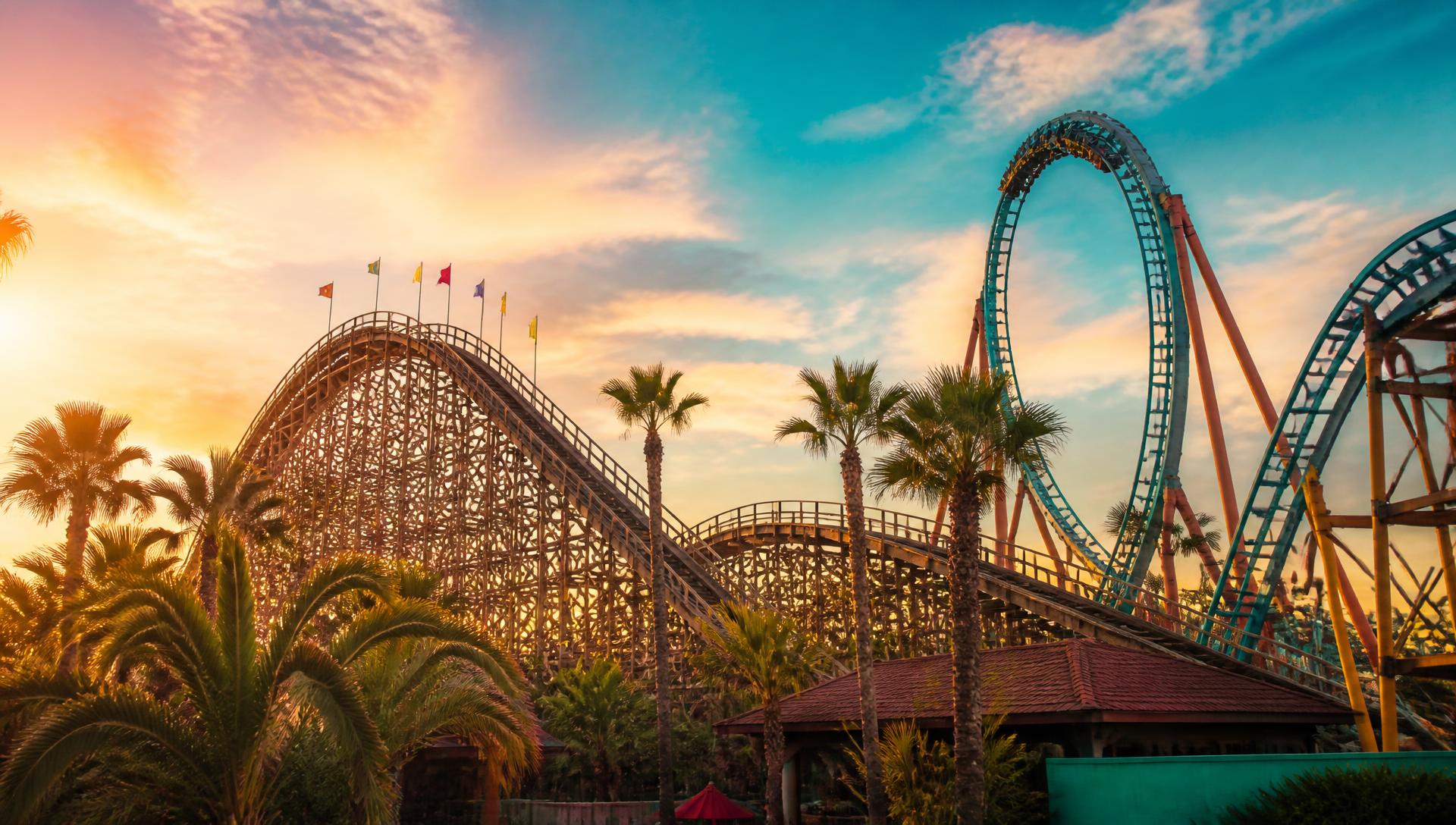 Roller coaster silhouetted against a sunset sky