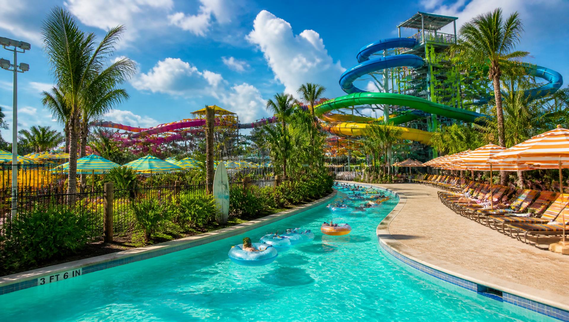 Tropical water park with slides and palm trees